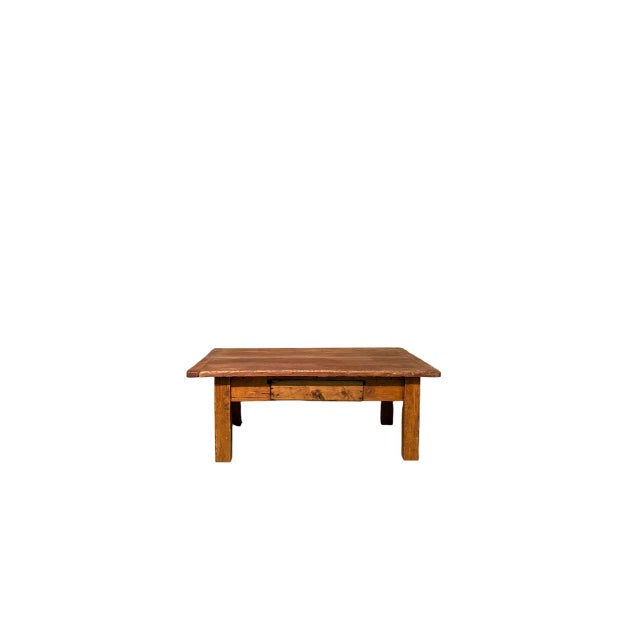 Low table in spruce wood from the 1800s with a drawer on the front.