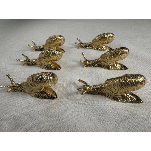 A blend of craftmanship and natural charm create a statement piece for these polished brass snail cabinet knobs. They're...