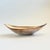 A mid century silver plated oval canoe shaped bowl. Made by Reed and Barton, original label attached to the base. Measures...