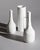 A curated trio of sculptural biscuit porcelain vases produced by ak kaiser in west germany during the 1970s, featuring...