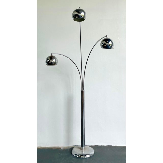 Illuminate your interior with the bold, futuristic aesthetic of the Space Age with this monumental vintage chrome floor...