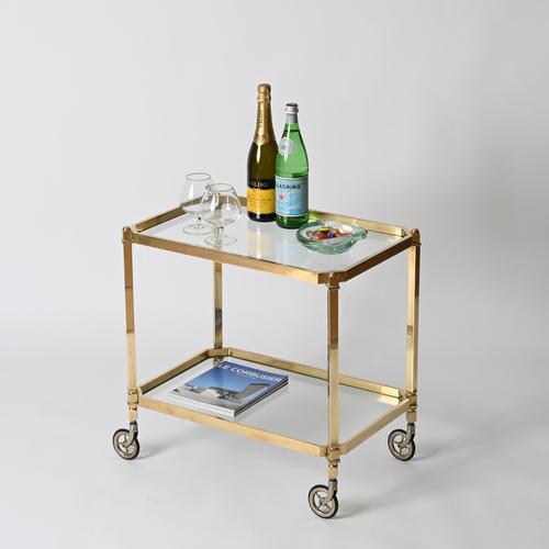Magnificent mid-century bar cart entirely crafted in solid brass. This elegant and distinctive octagonal serving cart was...
