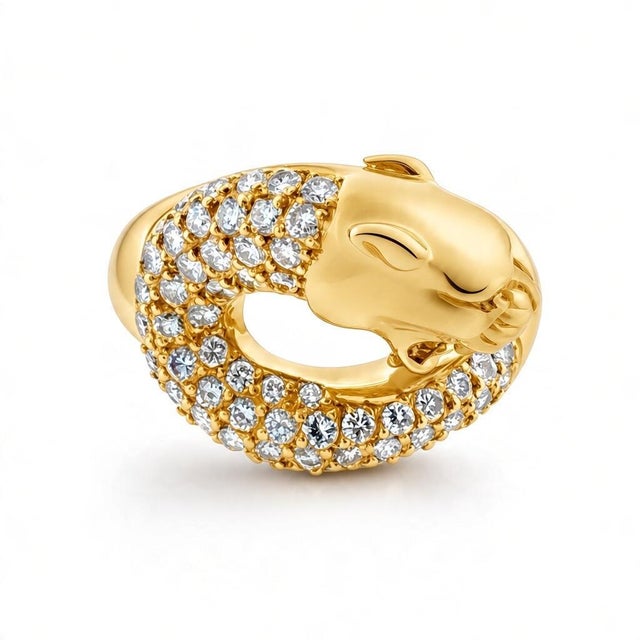 Vintage Carrera y Carrera 18K yellow gold ring showcasing a sculpted panther motif, adorned with meticulously set...
