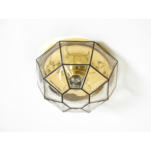 Beautiful original 1970s glass ceiling lamp in an octagonal shape. the shade has small air bubbles. manufactured by...