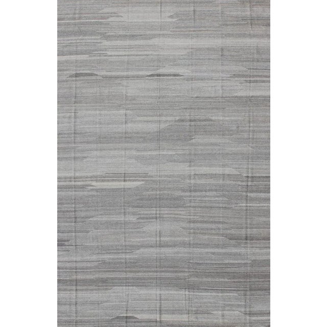 Modern and casual flat-weave fine hand made Kilim rug in gray tones and Neutrals with Minimalist design and solid pattern...