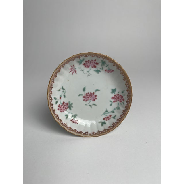 This Chinese export floral saucer dish is a beautiful example of the fine porcelain crafted for the Western market during...