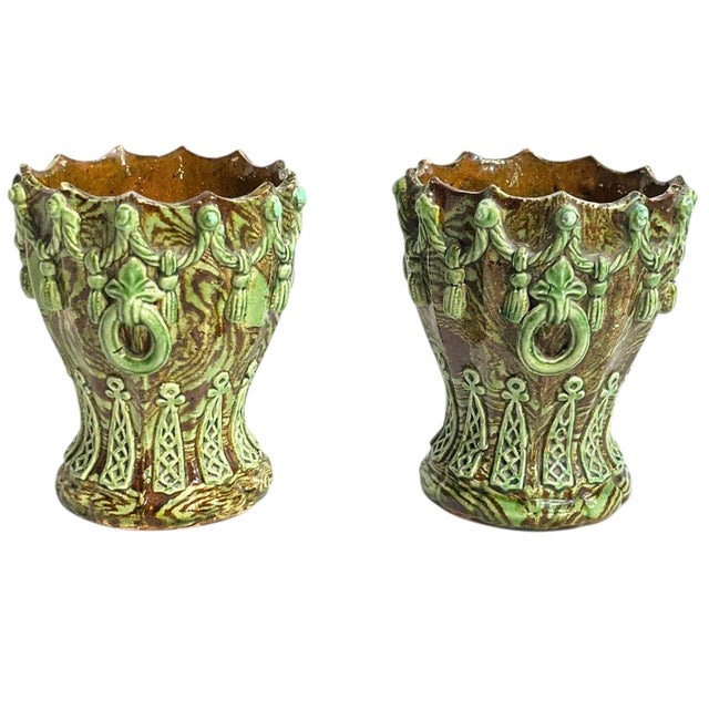 Charming matched pair of antique French Majolica planters or jardinieres. Scalloped trim with Trompe l’oeil rope and...
