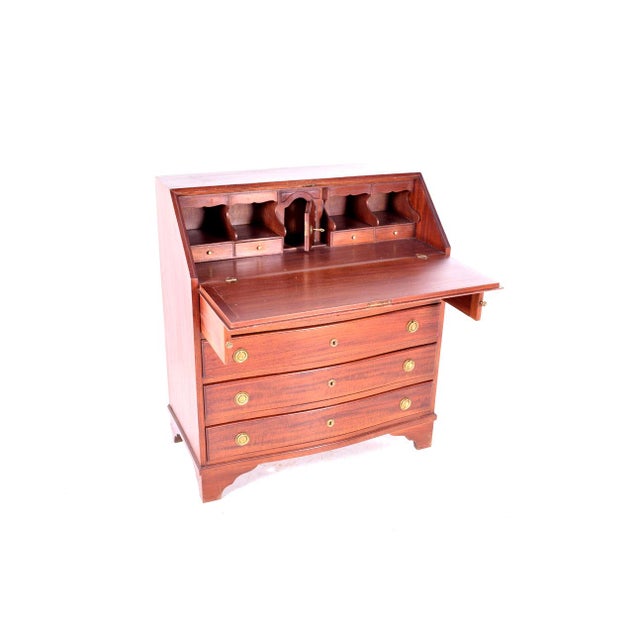 Antique bureau in mahogany, Portuguese. An attractive antique 19th century mahogany desk. The antique desk has a drooping...