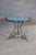 This exceptional French center table is a striking marriage of natural luxury and elegant wrought iron craftsmanship,...