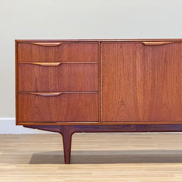 This elegant small sideboard, designed by Tom Robertson in the 1960s in Scotland , epitomizes the refined craftsmanship of...