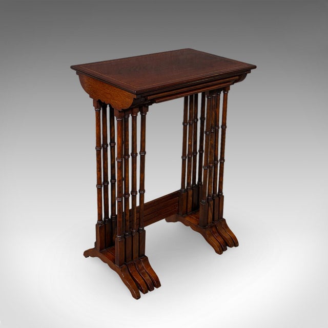 This is an antique quartetto of tables. An English, mahogany nesting set of occasional tables, dating to the Edwardian...