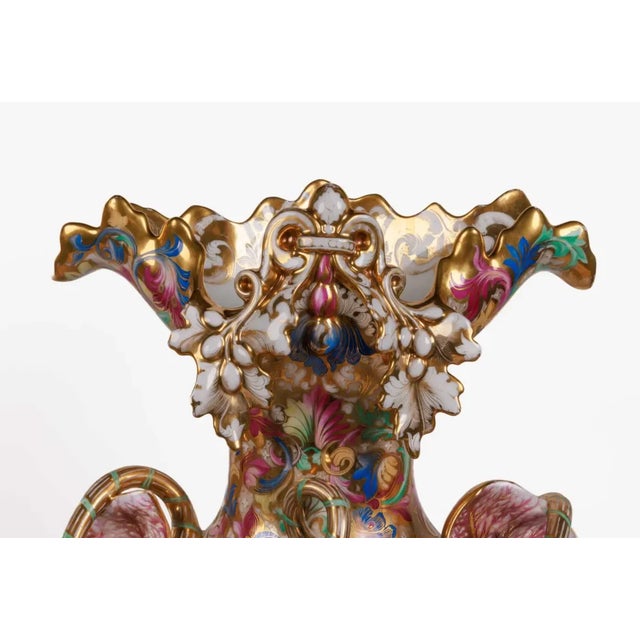 A monumental and masterful pair of French Paris porcelain hand-painted vases, circa 1860. These museum quality vases are...