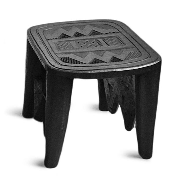 Vintage Nupe stool with beautiful rich ebony black finish with traditional geometric style carvings. Each is sold...