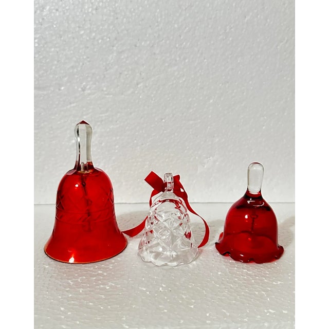 Trio of festive red bells. Great for Christmas holiday decorating. The largest bell is embossed with an X pattern as well...