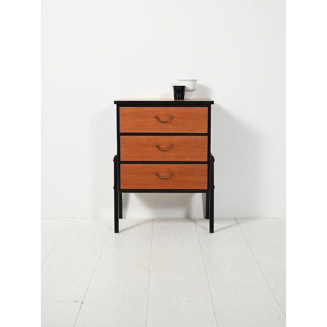 Small Scandinavian chest of drawers from the 1950s, black lacquered with teak drawers and brass handles, with original...