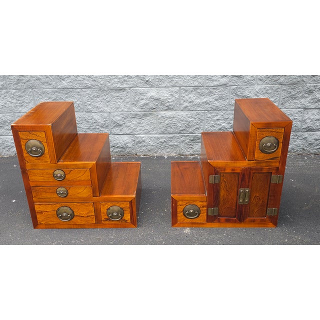 A South East Asian Tansu Double-Sided Two-Part Interlocking Cabinet. Finished on all sides. Drawers and doors open and...