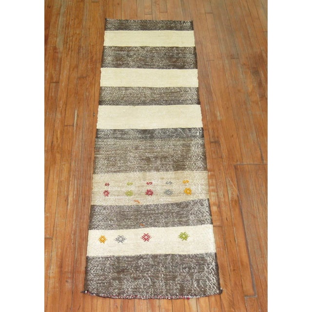 One of a kind, mid 20th-century Hand-knotted weather appealed Turkish Kilim runner. Professionally Washed & personally...