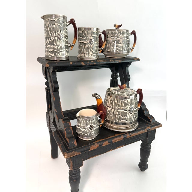 This English ceramic tankard is in the Silver Shield pattern, an Art Deco design by Arthur Wood in the 1930s. For those...