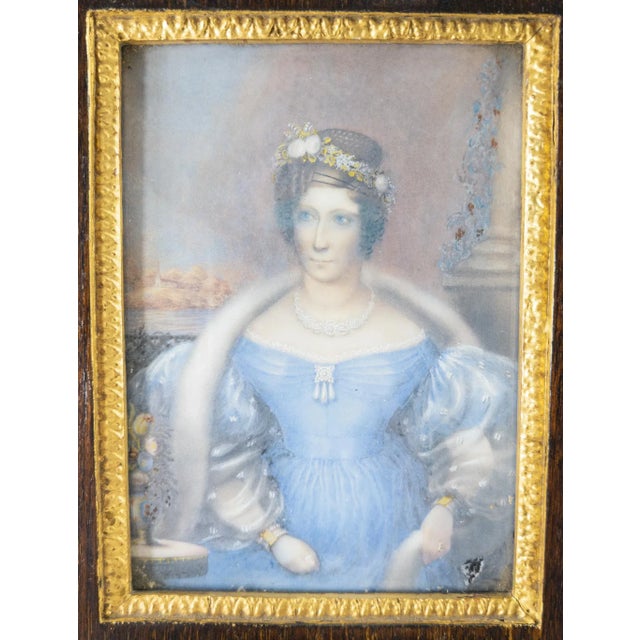We are offering this extremely finely painted miniature portrait. This watercolor portrait is of a very finely dressed...