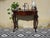 Console table that unfolds into a games table. Antique, late 19th-century craftsmanship in solid mahogany. rectangular top...
