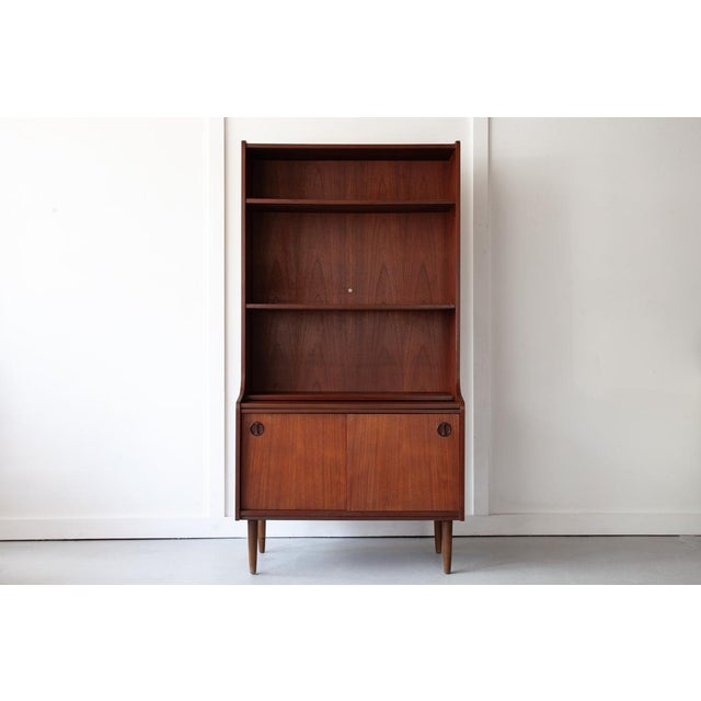 A beautiful Danish bookcase in teak, produced in the early 1960's by Farsø Møbelfabrik. These classic mid century units...