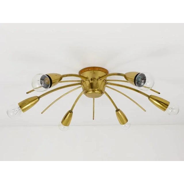 A beautiful brass chandelier / flush mount from the 1950s, executed by Kalmar Austria. In good condition with nice patina...
