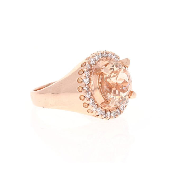 4.61 Carat Natural Morganite Diamond 14 Karat Rose Gold Cocktail Ring This ring has a natural 3.96 Carat Round Cut...