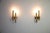 This elegant pair of wall lamps was designed by gaetano sciolari in italy during the 1960s. characteristic of sciolari’s...