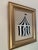 A striking black-and-white circus tent painting set against a warm sand-toned background, creating strong graphic contrast...