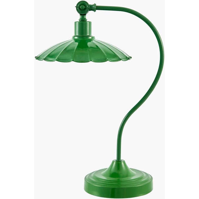 Illuminate your space with the striking allure of the Pavona accent table lamp, where industrial meets rustic in a...