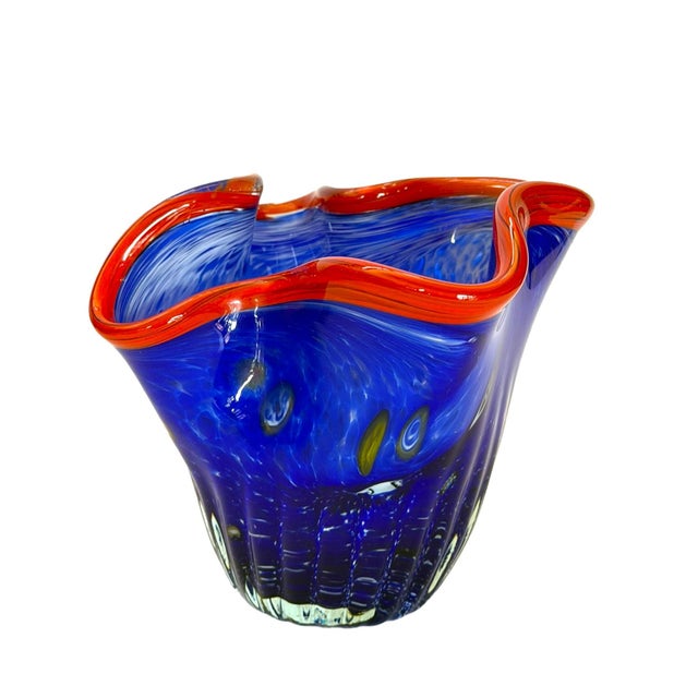 This small but full of charm ruffled handkerchief vase is a hand-blown art glass made by a glass artist who was probably...