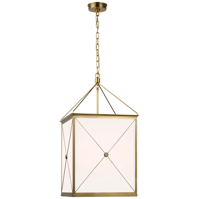 Rossi Medium Lantern in Antique-Burnished Brass with White Glass Designer: Julie Neill Canopy: 5.5" Round Mounting: Chain...