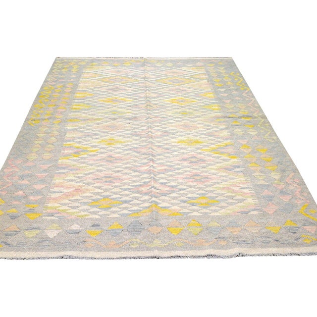 Hand-knotted with care using traditional rug-making techniques, this wool rug blends timeless craftsmanship with a modern...