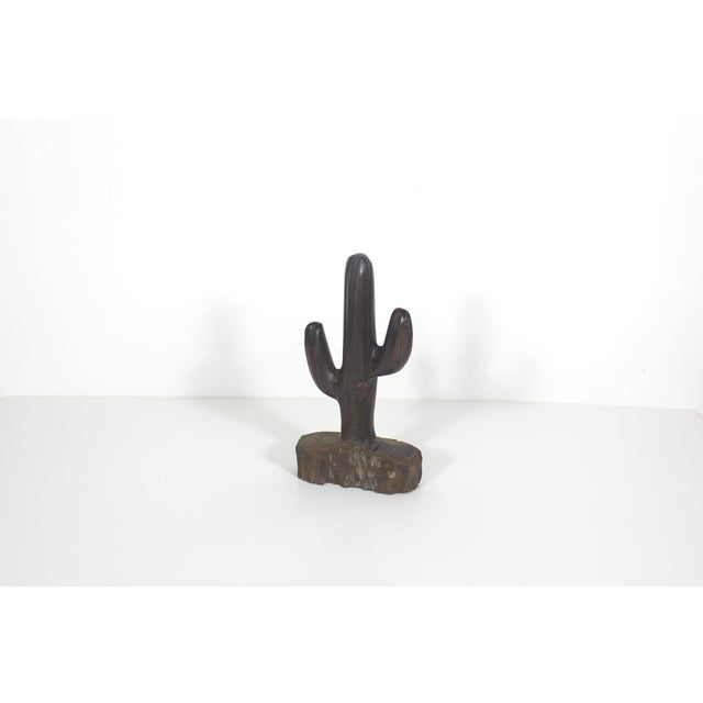 So fun! Hand carved ironwood cactus figurine. Dimensions: 7.25” tall 4” wide 1.75” deep
