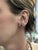 Grace your everyday with a touch of deep elegance—these martini-set London Blue Topaz studs in solid 14k yellow gold bring...