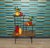 Beautiful tall, large plant stand in classic 60s/70s style. Decorative plant stand with 3 tiers. Made of teak-look Formica...
