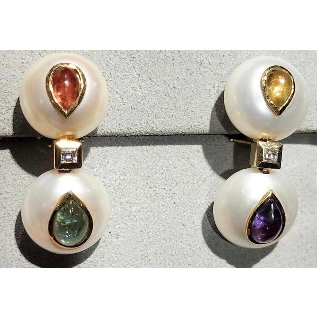 Pair of Christopher Walling.Freshwater Button Pearls inlaid with fancy color pear-shaped Sapphires and square Diamond...