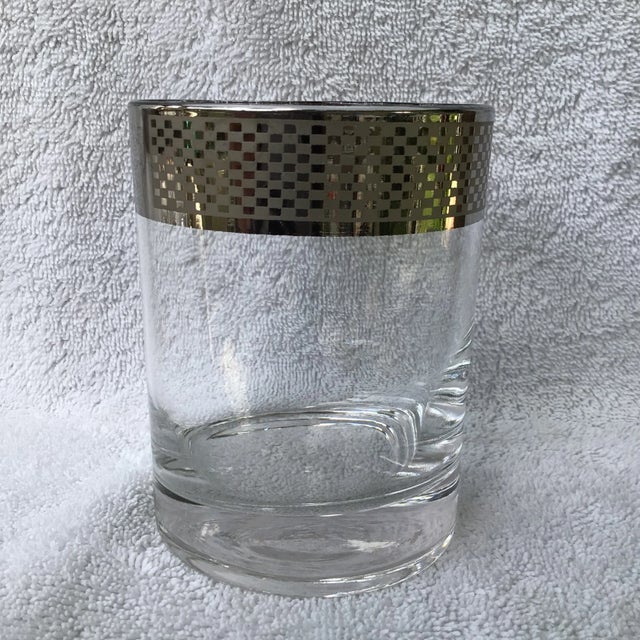 Very unusual design in platinum along the rim of these double old fashion glasses. I have seen them with the same pattern...