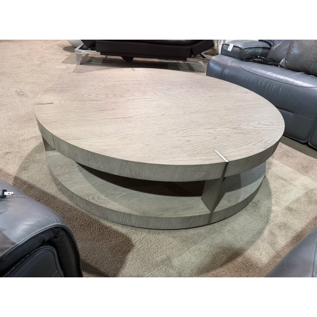 The Restoration Hardware “Verrazano” Coffee Table is a striking study in architectural form, material contrast, and modern...