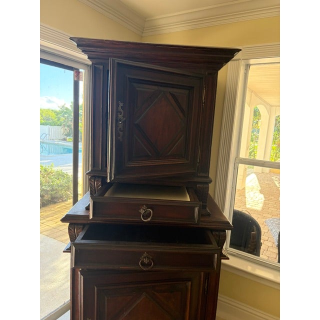 The Antique French Louis XVI Buffet a Deux Corps is a stunning piece of furniture that exudes elegance and sophistication....