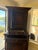 The Antique French Louis XVI Buffet a Deux Corps is a stunning piece of furniture that exudes elegance and sophistication....
