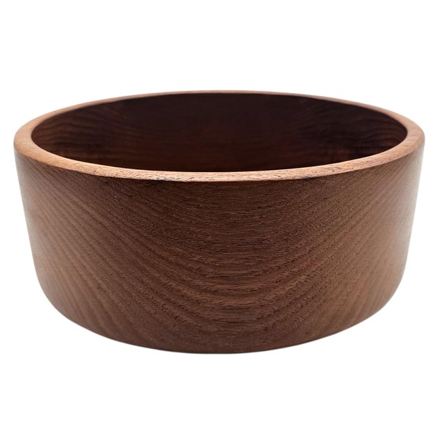 A beautifully turned mid-century solid teak serving bowl showcasing the warm natural grain and refined simplicity...