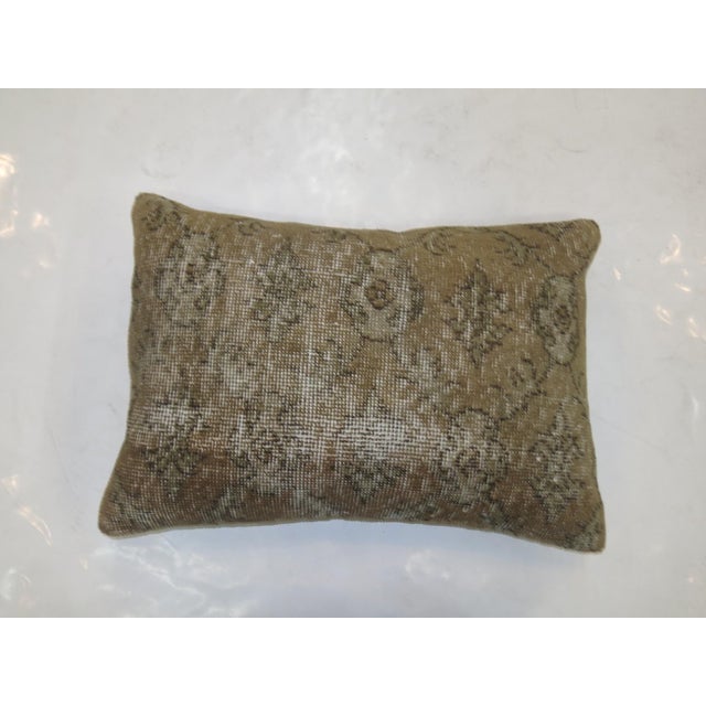 Pillow made from a worn turkish rug