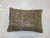 Pillow made from a worn turkish rug