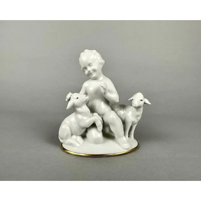 The highly detailed german white porcelain figurine putti with lambs in gilding by gerold porzellan - bavaria, 1960s. very...