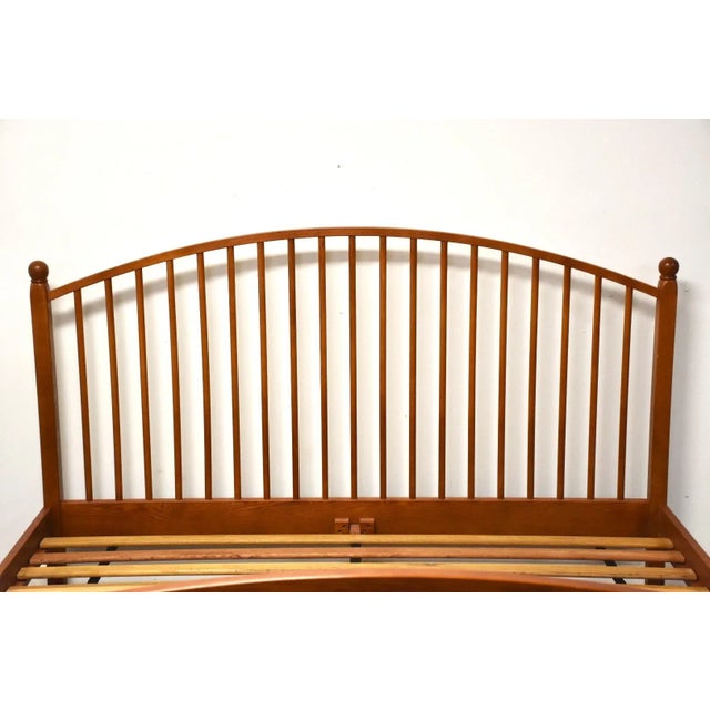 A cherry colored oak king size mission style bed frame. Comes with a headboard, footboard, side rails and slats. 78” wide....