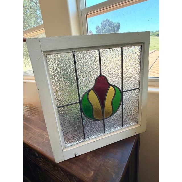An authentic architectural antique English leaded stained glass window, dating to the Edwardian era (circa 1900-1915)....