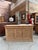 This antique fir sideboard has been fully restored. It features a functional drawer in the center and three lockable doors...