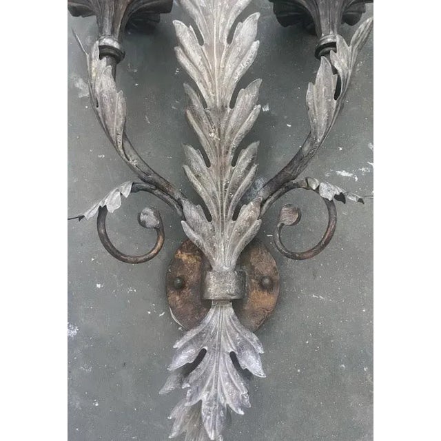 A hard to find pair of silver fine art 3-light wall sconces. Hard wired.