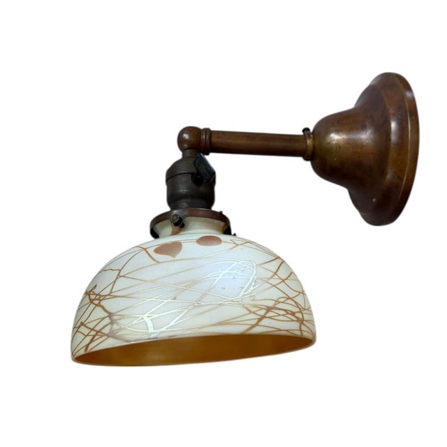 Timeless and gorgeous, this wall sconce will look charming in any room of the house. The stamp/signature has faded over...